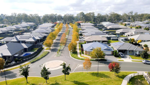 An elevated perspective revealing a surrounding residential area at Appin Grove, showcasing a well-planned community with.